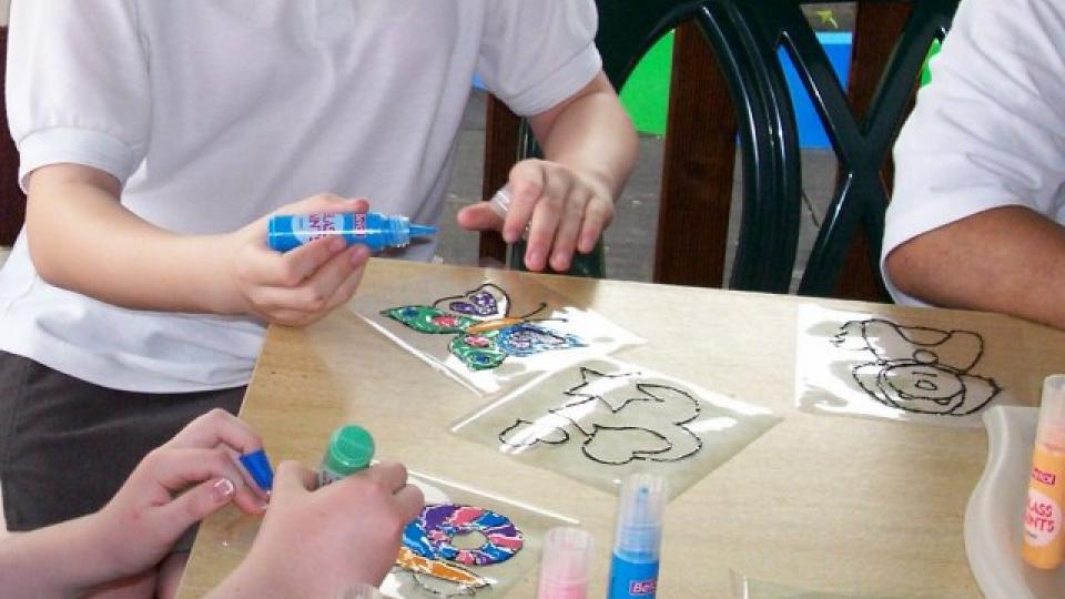Children doing glass painting