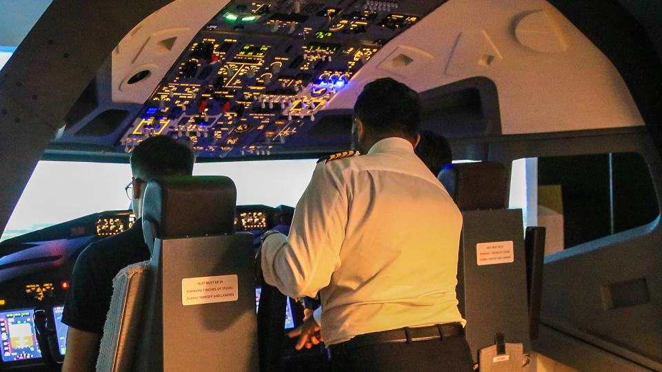 An instructor offering advice in FLightPad, the flight simulator at UWL