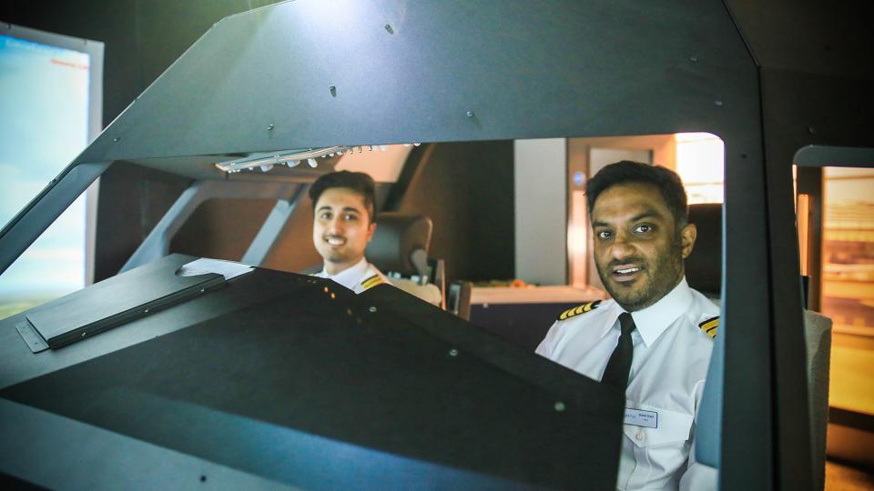 A pilot and co-pilot at the FlightPad flight simulator at the University of West London