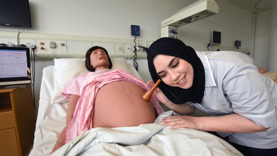 Midwifery students practice their skills