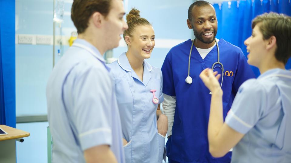 Group of nursing students smiling and talking