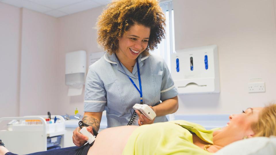 A midwife performing an ultrasound