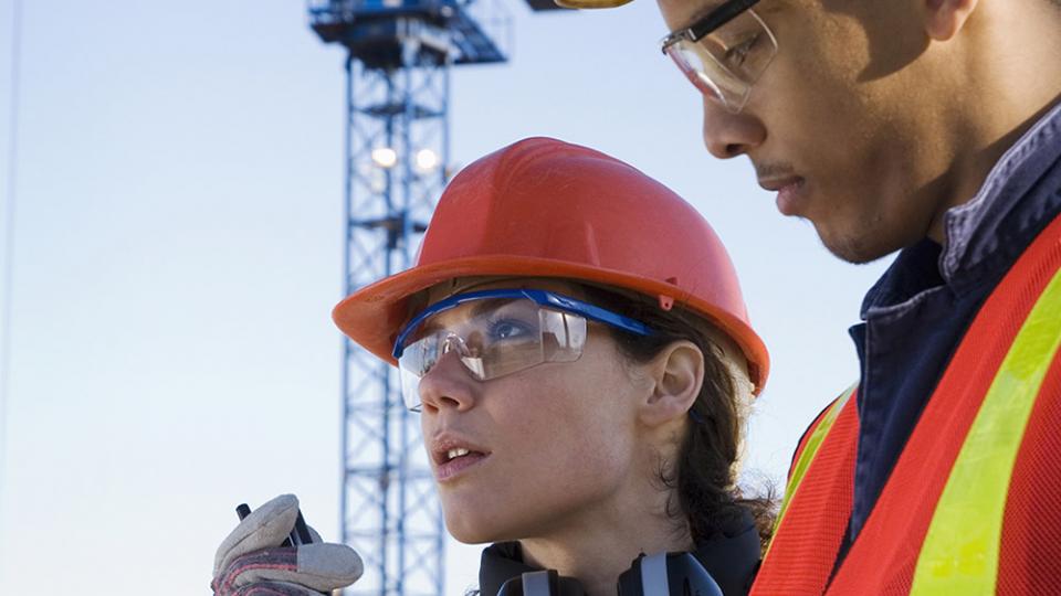 Two civil engineers at a construction site