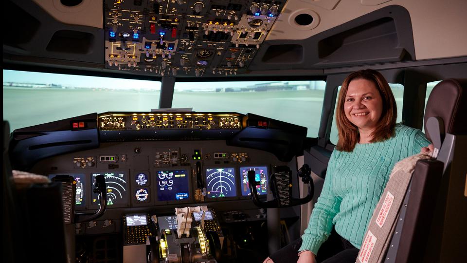 An aspiring pilot in the cockpit of a 737 simulator