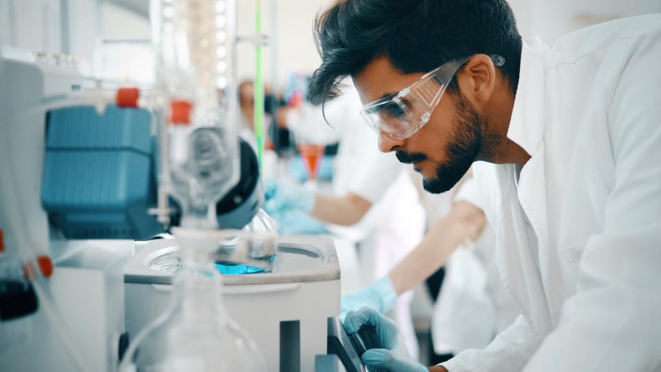 student in goggles in the lab