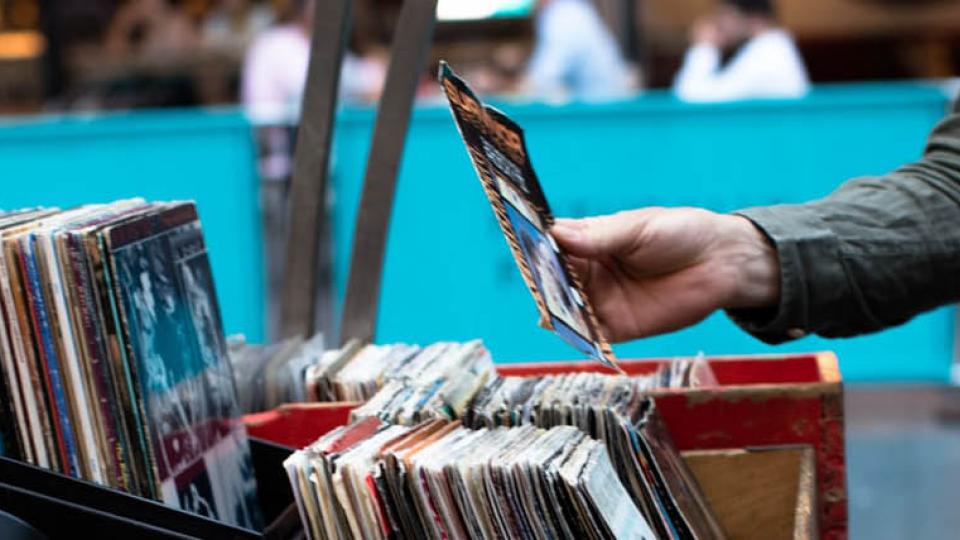 Two shoppers at a record stall looking at records