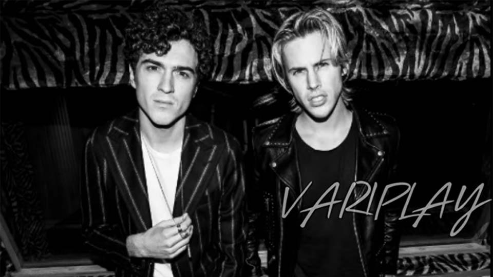Two featured musicians from the variPlay app pictured. One wears a blazer and the other wears a leather jacket 