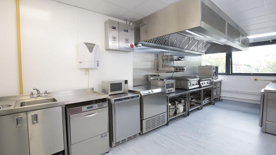 The West London Food Innovation Centre's innovation kitchen. Several steel appliances including specialised ovens, microwaves etc