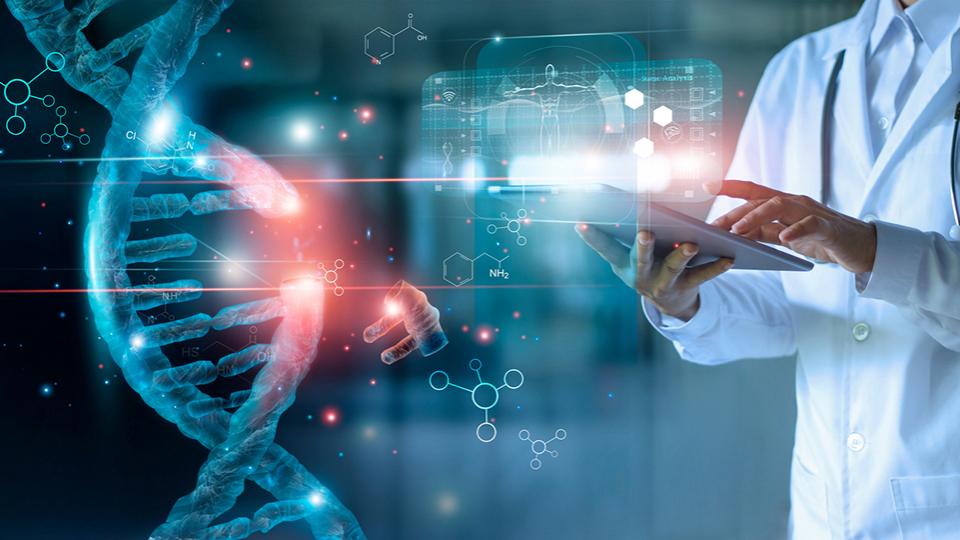 A man in a lab coat with a stethoscope around his shoulder looking at the a DNA gene sequence on an electronic tablet