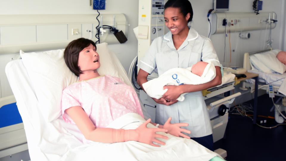 A student midwife practices her skills