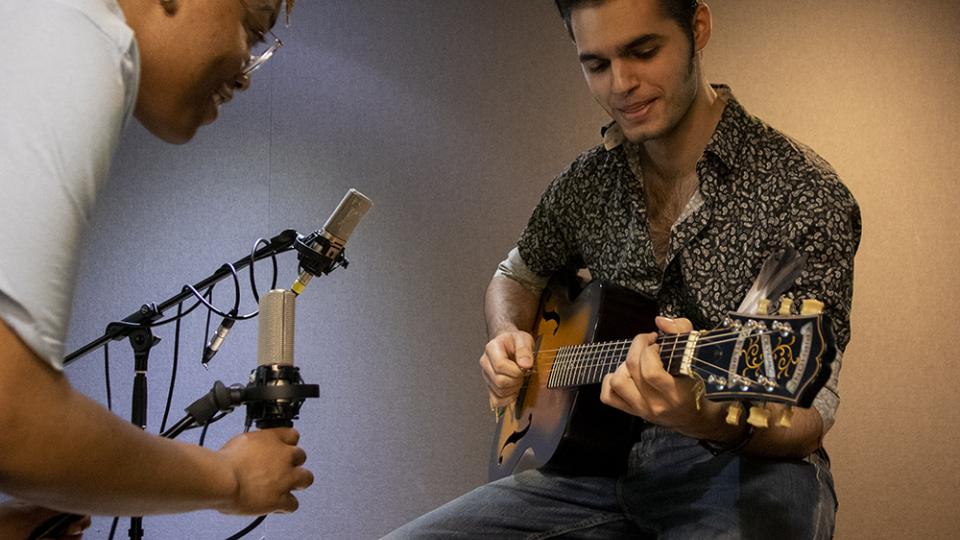 Student guitarist being recorded