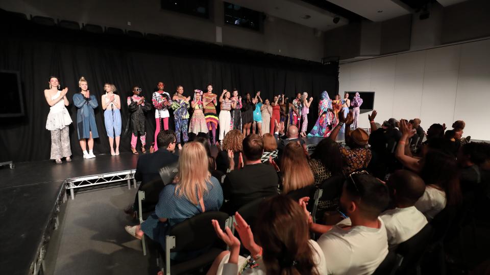 ARTSFEST 2022 - fashion show showing all the students involved on stage.