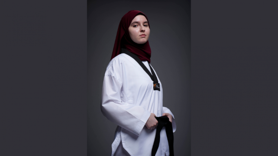 Student photography of a female wearing a martial arts uniform.