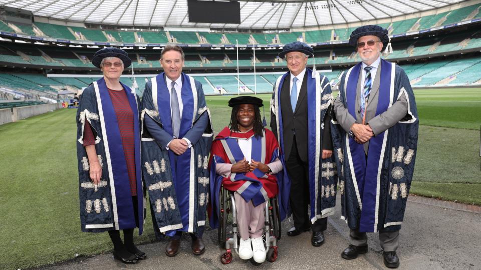 Ade Adepitan pitchside at Twickenham with UWL governers including Laurence Geller and Peter John.