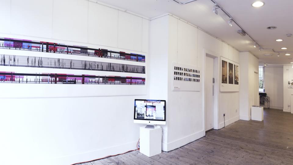 A selection of photography and visual effects work displayed on white walls.
