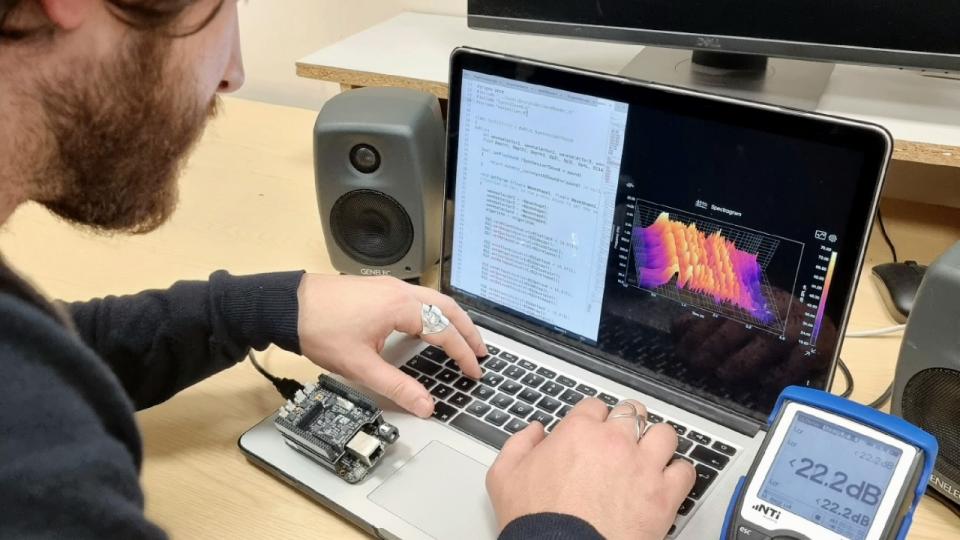 A student practises his digital audio engineering on a laptop