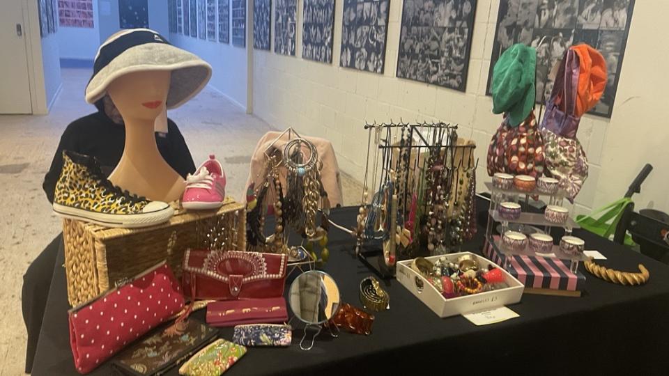 A selection of fashion accessories laid out on a table including jewellery, hats and purses for the Next Stop Fashion event.