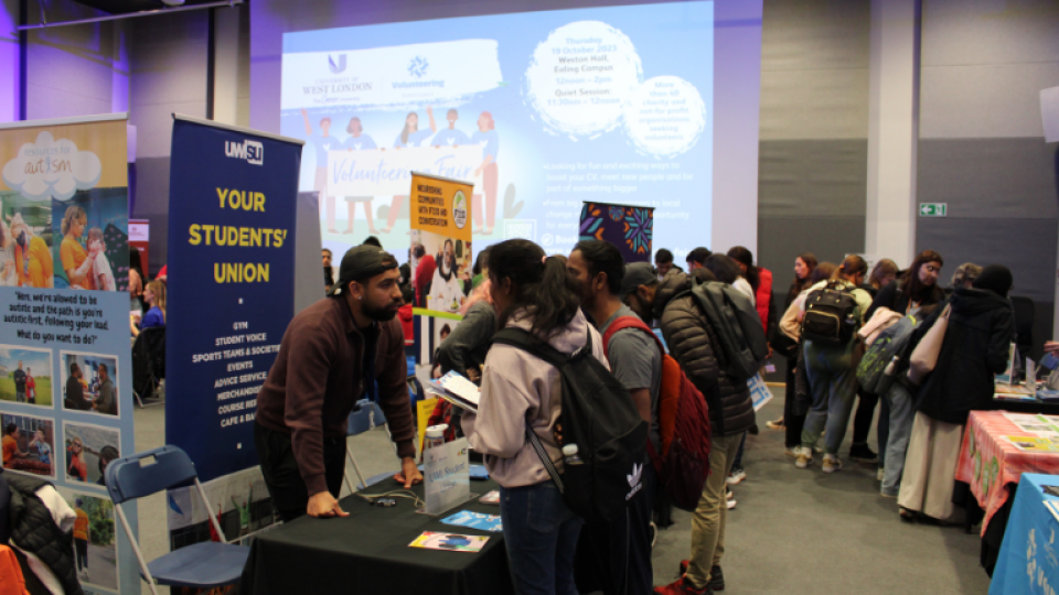 A group of students attending the Students' Union stand at the volunteer fair at UWL.