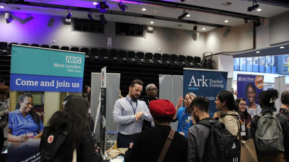 Stalls and students at the Life and Health Sciences Careers Fair