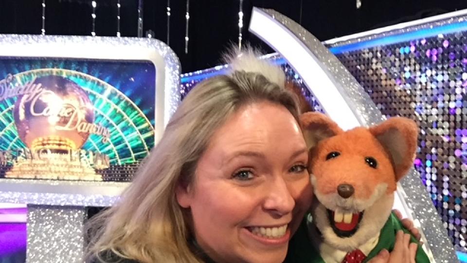 Eve Winstanley posing with Basil Brush behind the scenes of It Takes Two