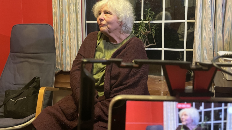 A woman being filmed for a video for AgeUK