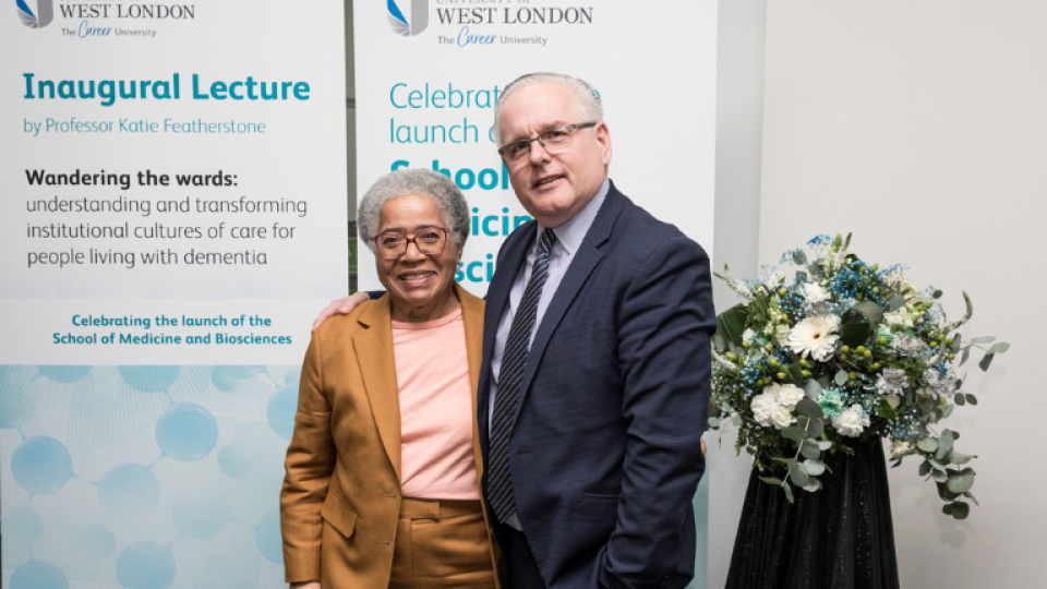 Anthony Woodman standing with Dame Elizabeth Anionwu at the School of Medicine and Biosciences launch event