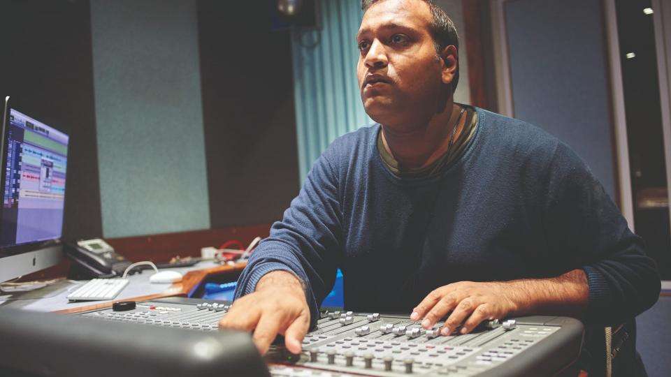 A man mixing at a sound desk