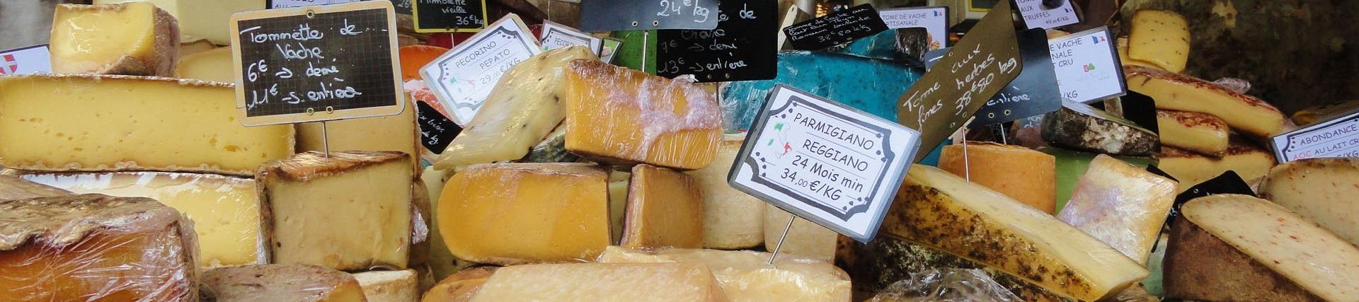 A selection of cheeses on display in a French market