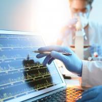 A biomedical scientist monitoring health data