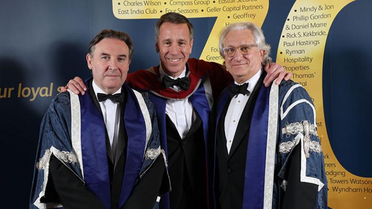 Three UWL professors in gowns