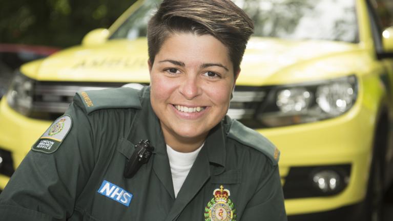 Paramedic in front of an ambulance