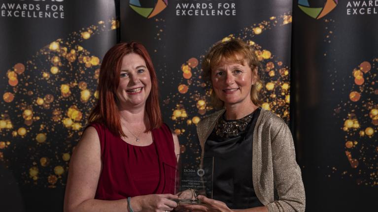 Two UWL representatives with the award
