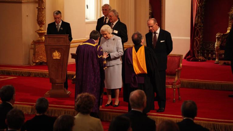 Professor Peter John CBE receiving the Queens Anniversary Prize from Her Majesty Queen Elizabeth II