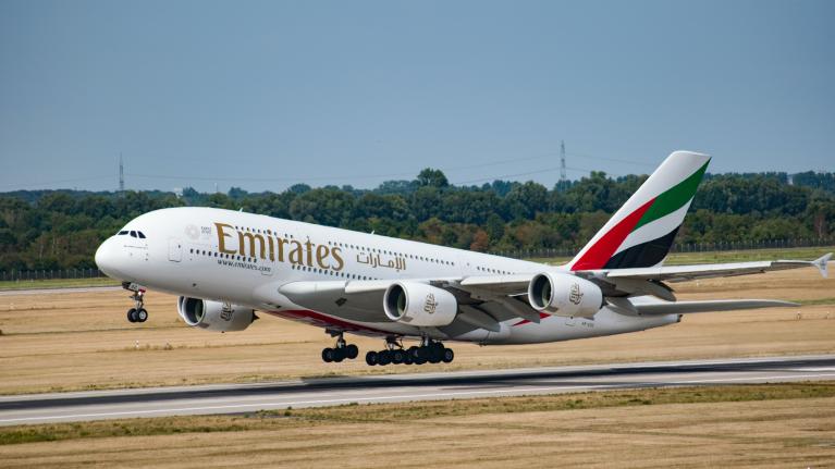 The Emirates A380 plane landing on a runway.