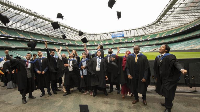 UWL 2023 graduates celebrating at the ceremony in Twickenham stadium