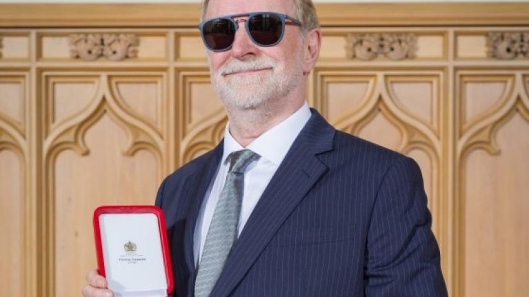 Sirens  Robin Millar posing with his knighthood medal