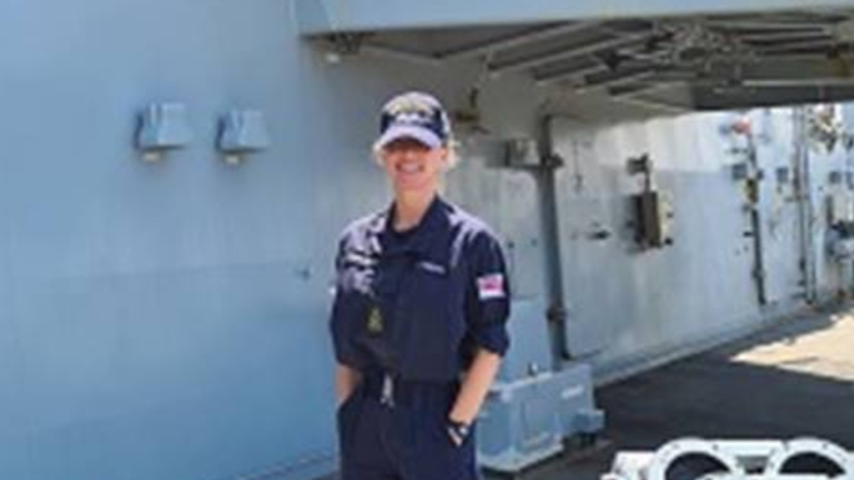 Former UWL student Hayley Lanilang standing on a Royal Navy ship