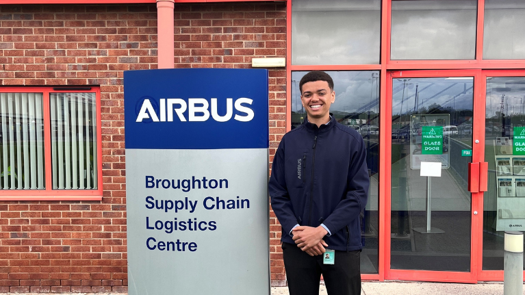 LGCHT student Irvine standing next to an AIRBUS sign.