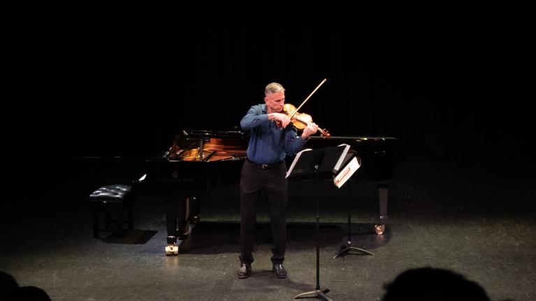 Violinist Timothy Schwarz performing onstage