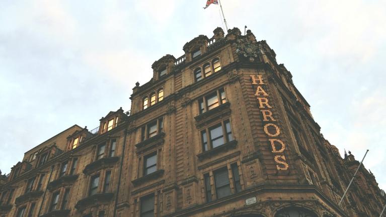 The exterior of Harrods on a cloudy day