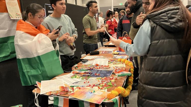 Students from UWL's Indian Society speak with interested students at Refreshers Fair 2024
