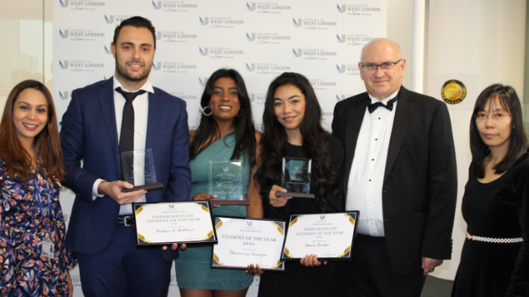 Three students and three staff members from the Claude Littner Business School posing at the awards ceremony