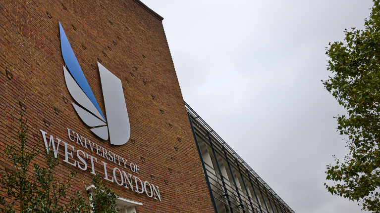 The UWL logo on the wall of the University's West London campus, Ealing site