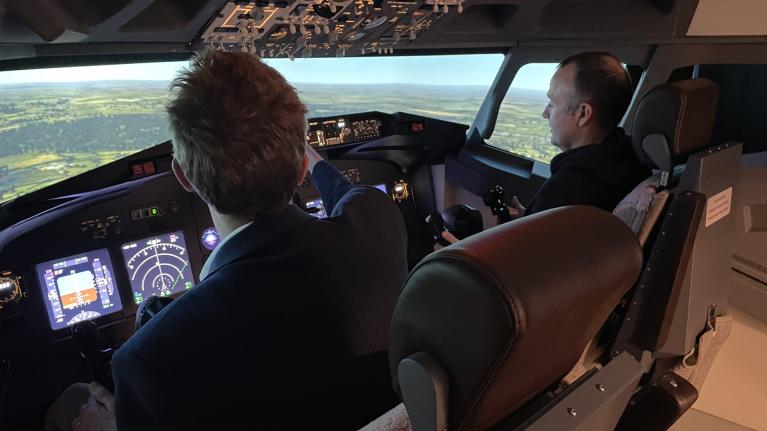 A degree apprentice student using the UWL FlightPad flight simulator