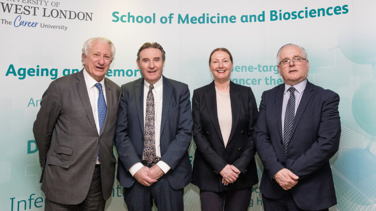 Laurence Geller CBE, Peter John CBE, Katie Featherstone and Anthony Woodman standing at the School of Medicine and Biosciences launch event
